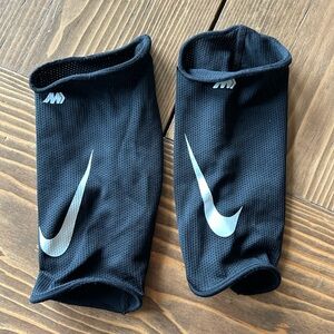 Nike Black Shin Guard Covers with White Swoosh size Large